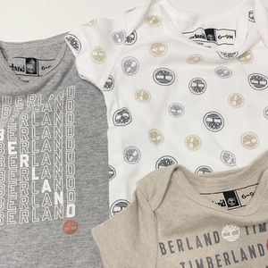 6-9M Timberland Variety Graphic Onesie 4pc. Bundle